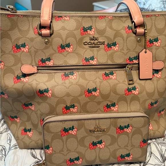 ***Gently Used*****Coach Tan Tote with matching wallet strawberry accents.